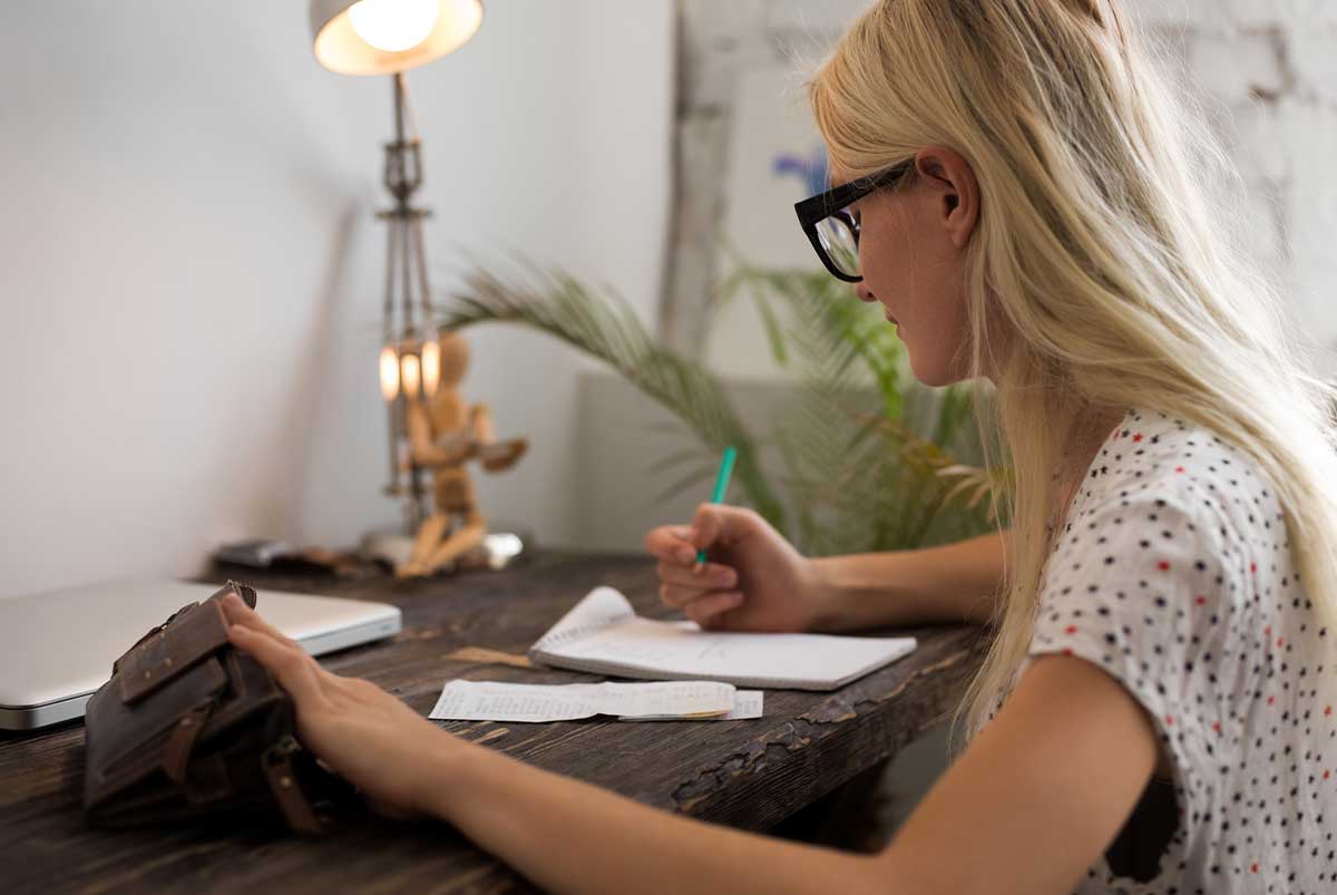 Woman writing in a notebook