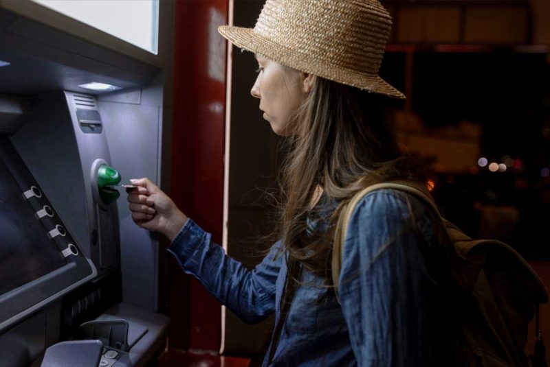 Woman using ATM