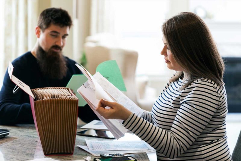 Couple reviewing financial papers