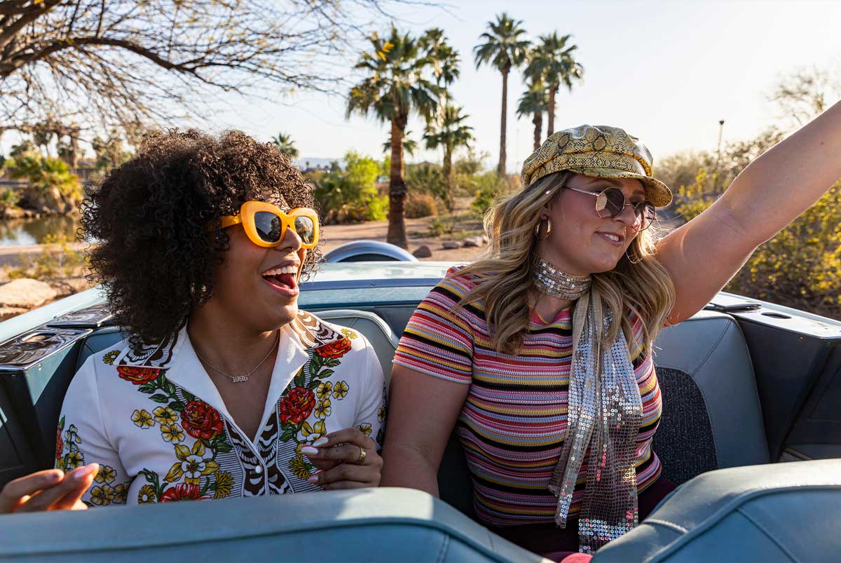 two girls in the back seat