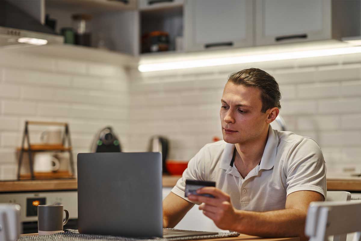 Young man looking at laptop