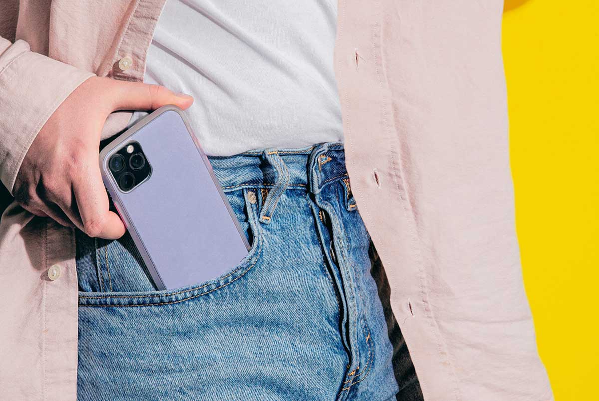 A conceptual image of a real estate agent putting a phone in their pocket.