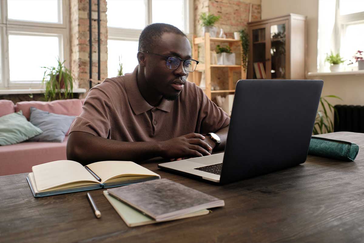 Man at desk with laptop computer