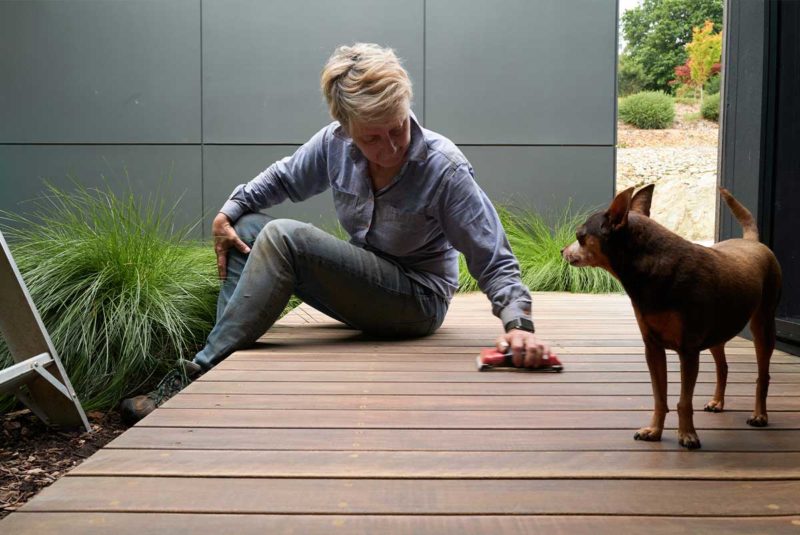 Woman on deck with dog