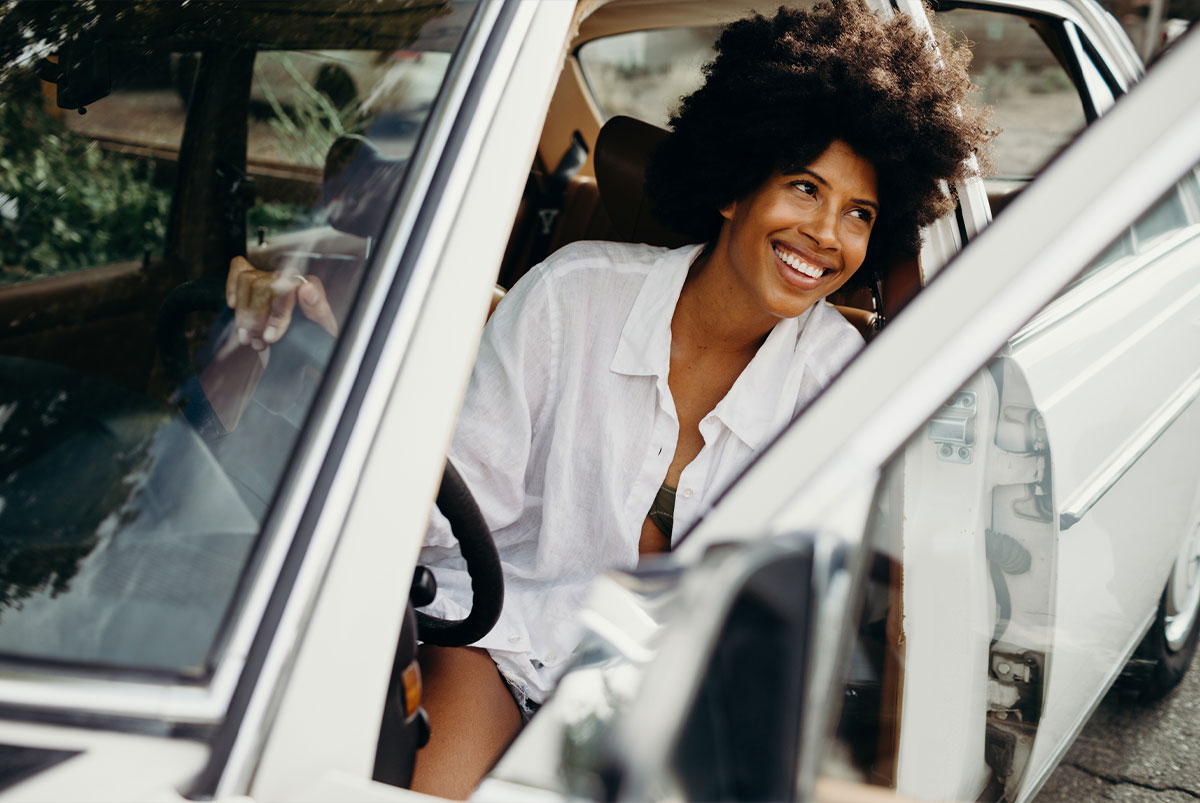 Woman getting out of car.