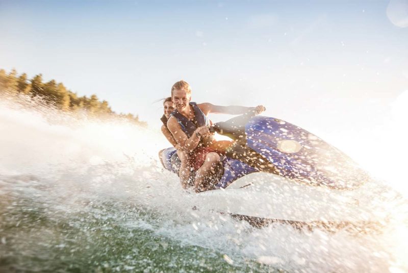 people riding a jet ski