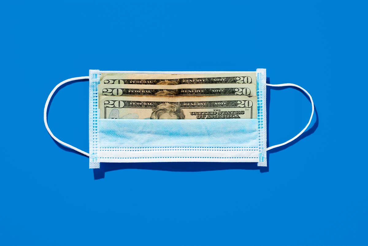 A blue background with a mask with dollars on it