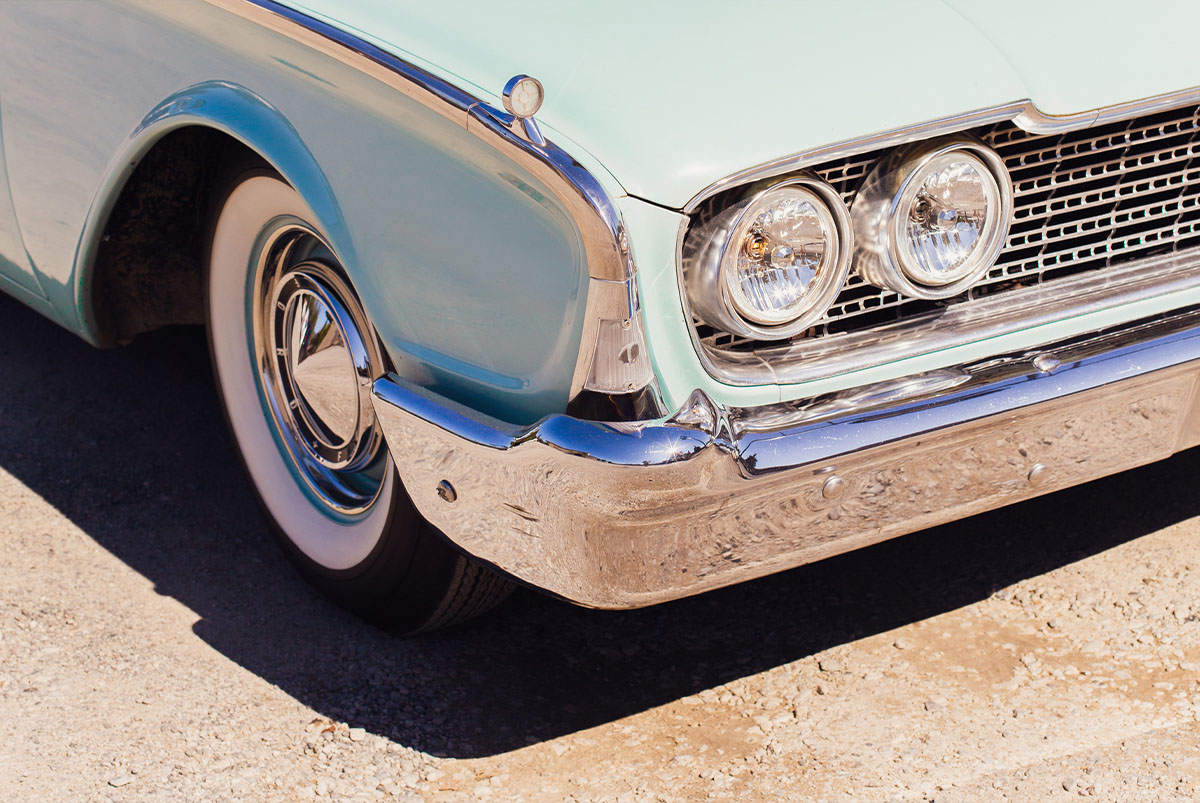 Vintage Aqua Car with Chrome Bumper and Whitewall Tires