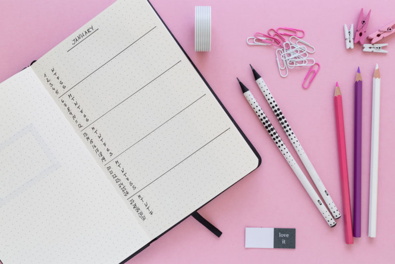 planner with assorted pens for student looking at grace period