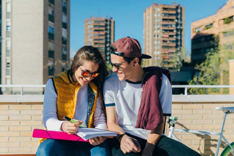 Couple looking at notebook