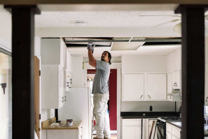 Man fixing ceiling