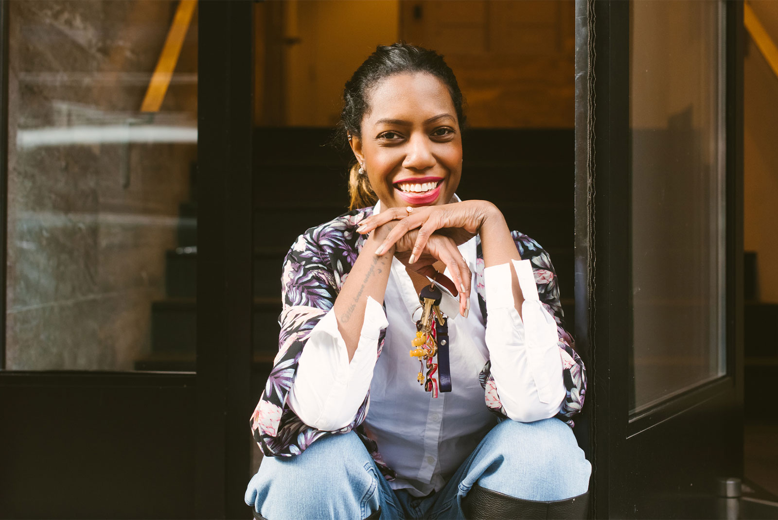 lady sitting outside her house as a first time home buyer