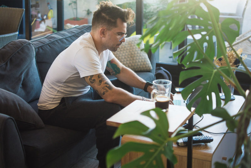 man on computer working out mortgage loan modification