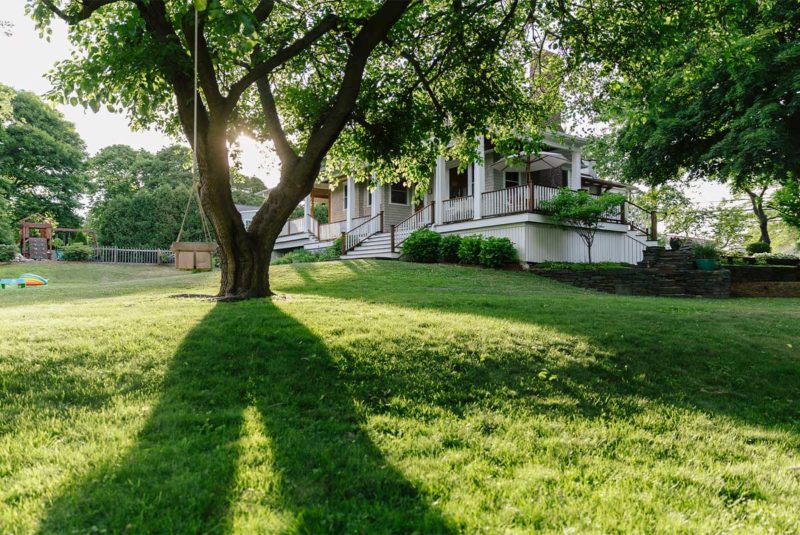 Large home with shade tree