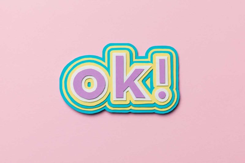 "ok!" on a pink pastel background