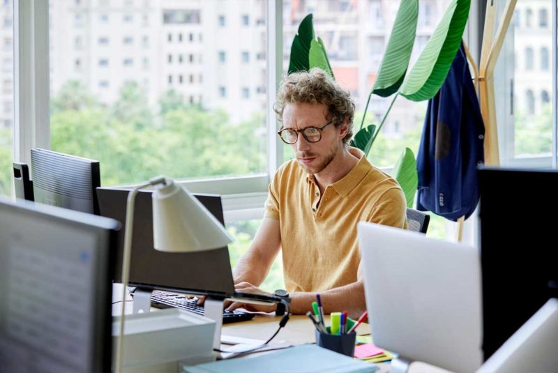 Man on his work computer