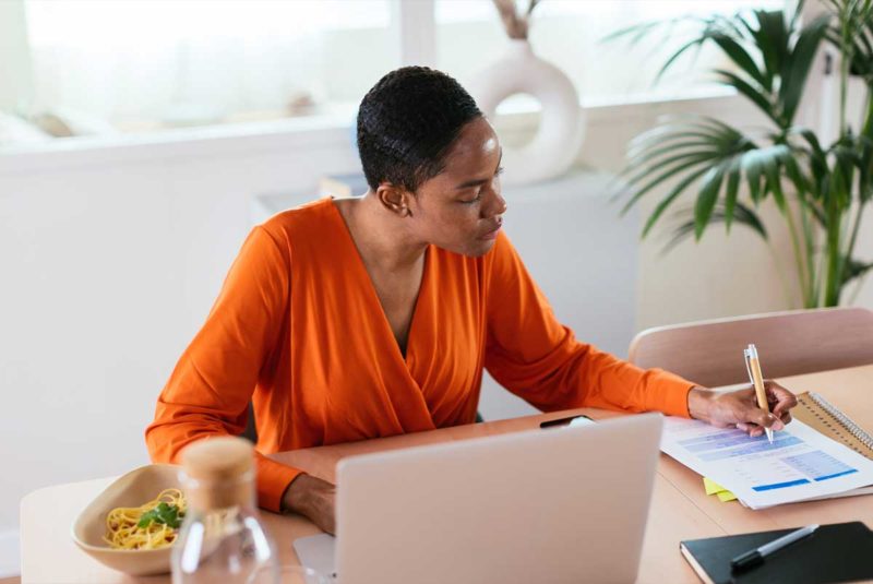 Woman filling out paperwork at lunch