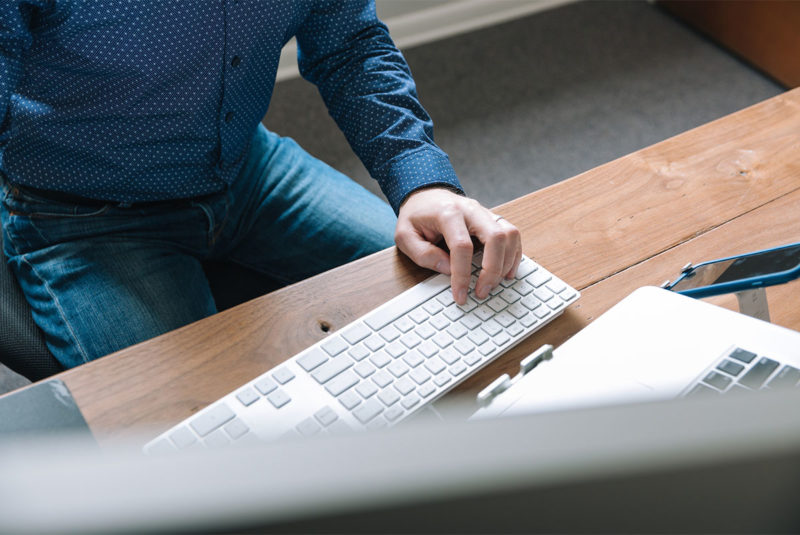 Person sitting at their desk job