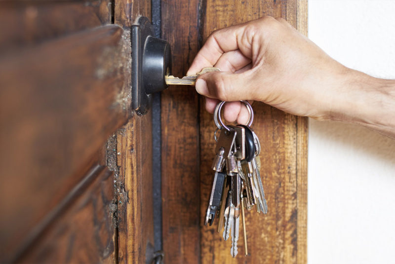 door lock being opened by keys