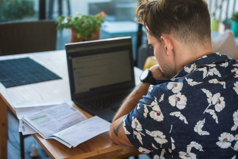 Man looking at his mortgage paperwork