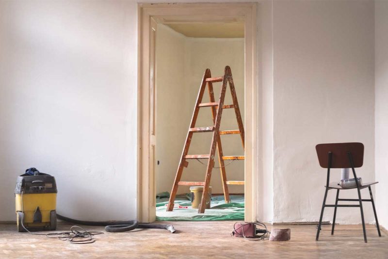 Living room ready for renovation with ladder