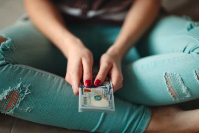 Woman holding money