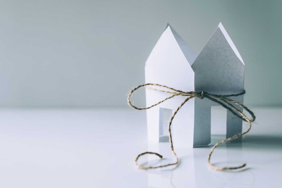 Paper house tied in string