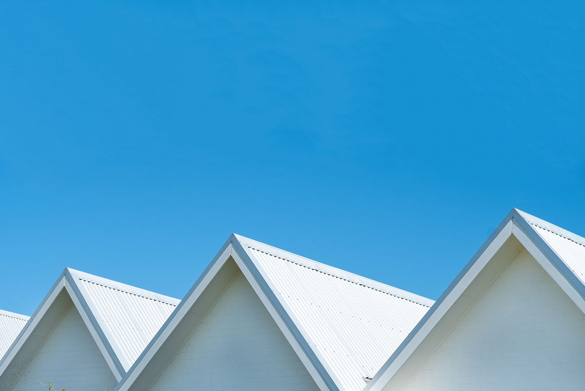 White house roofs against a blue sky