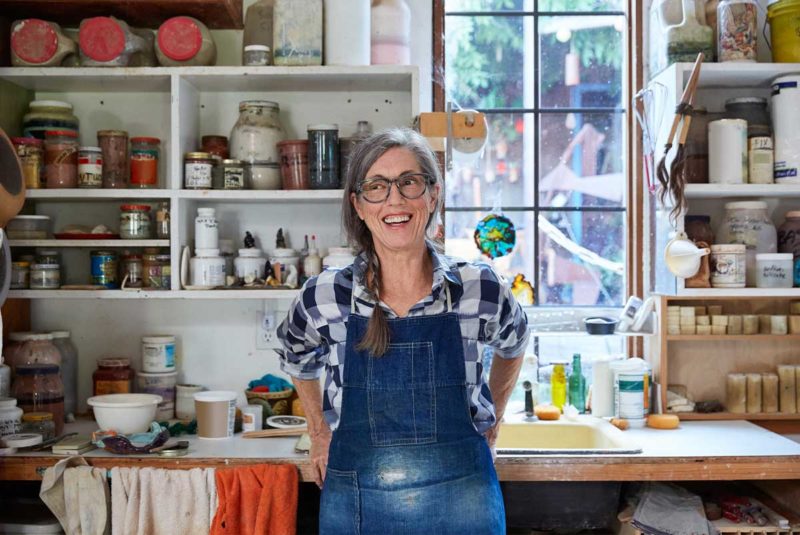 Woman in overalls in art studio