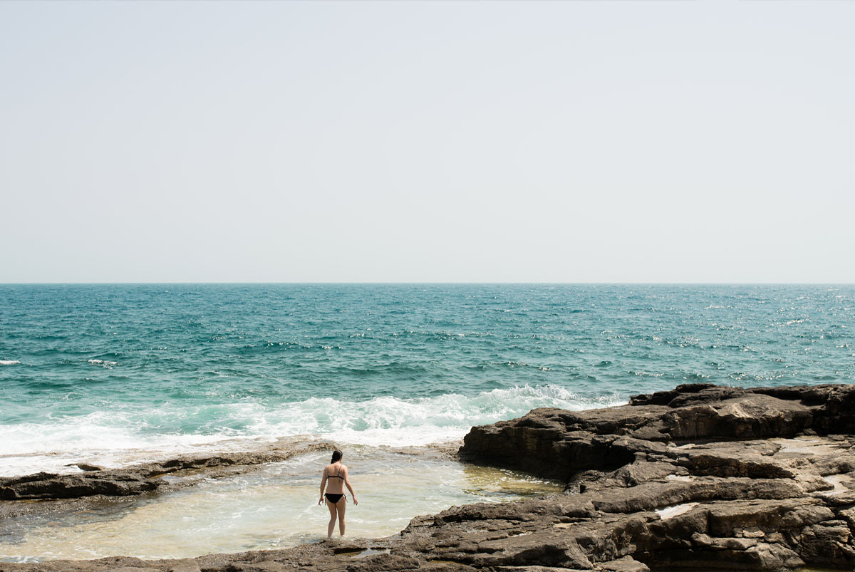 Woman swimming in the ocean on vacation