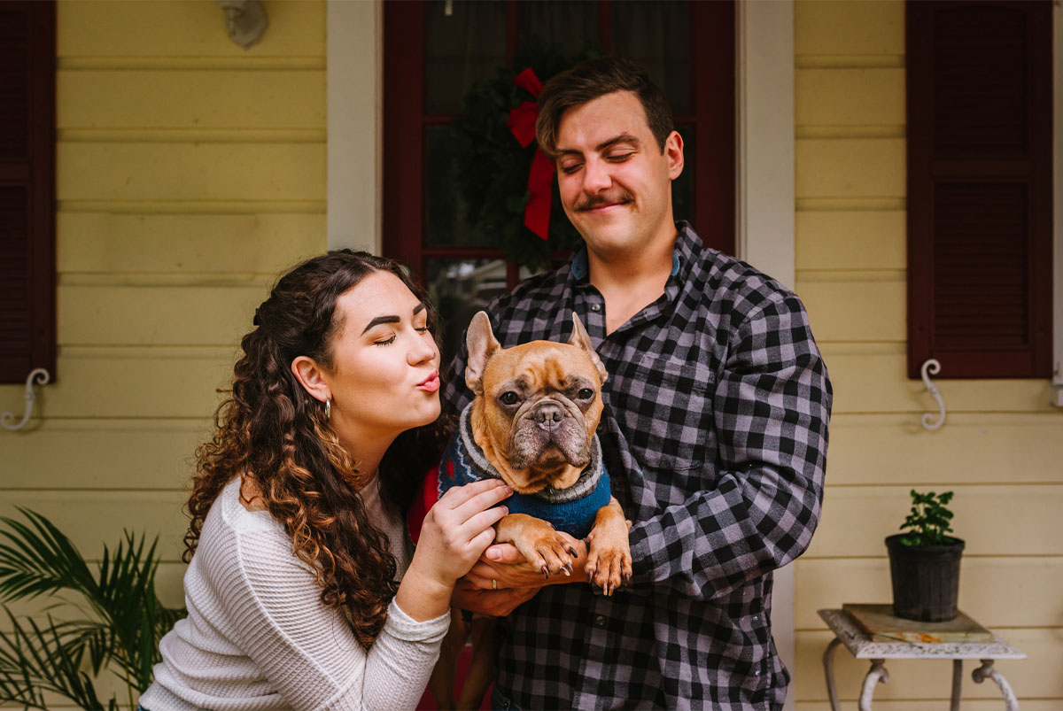 Young couple with French bulldog