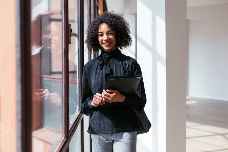 Young black woman with clipboard