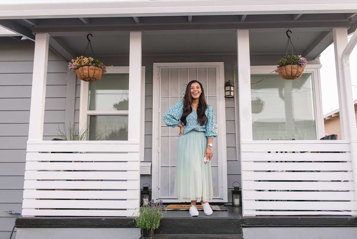 Woman standing on front porch