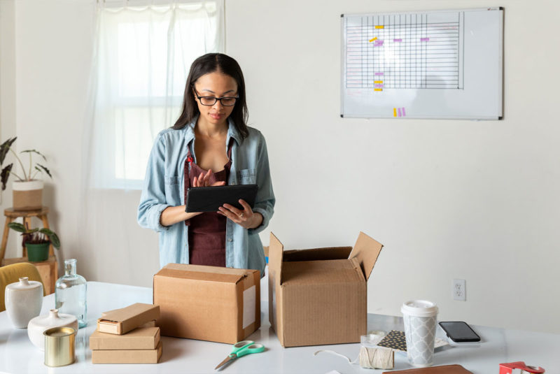 Woman inventorying boxes