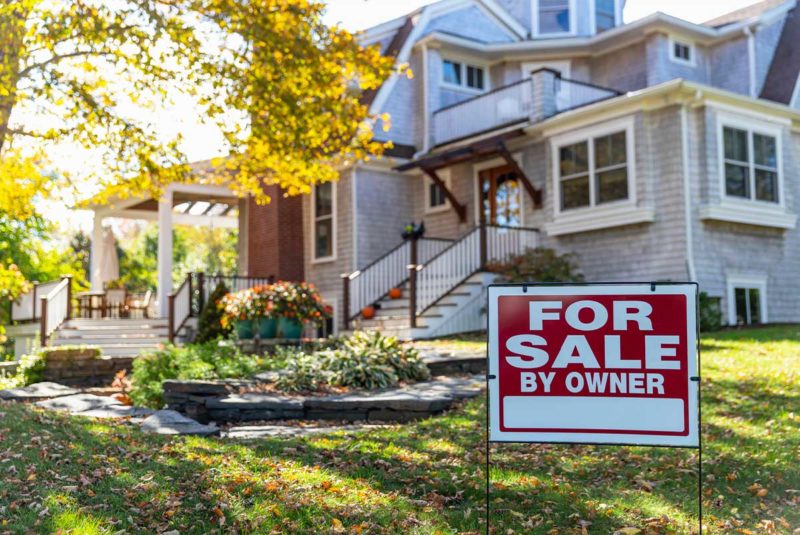 Home with For Sale By Owner Sign