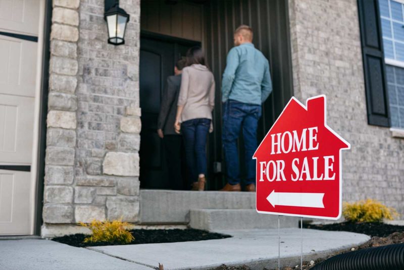 Couple entering home for sale