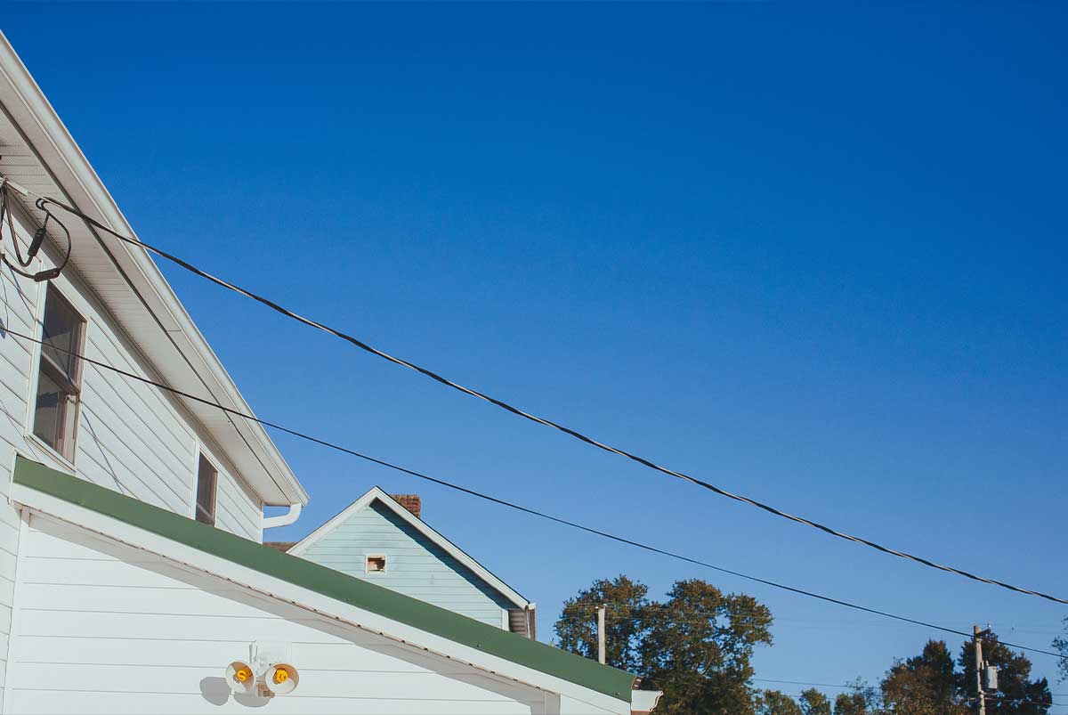 Rear of home with power lines.