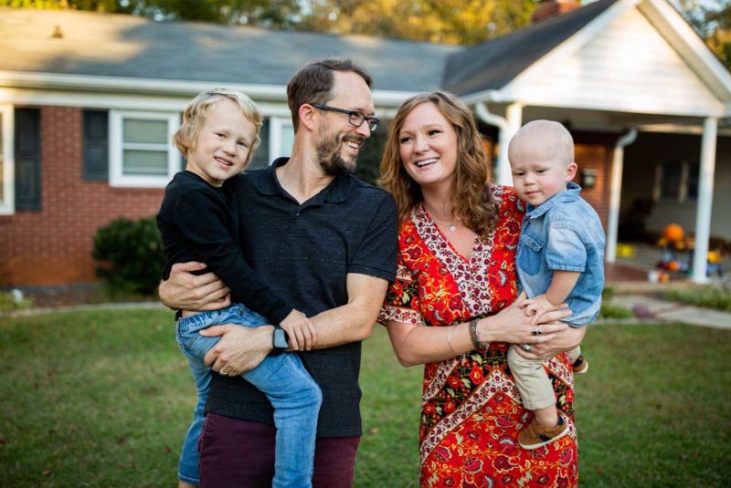 Family in front of a house