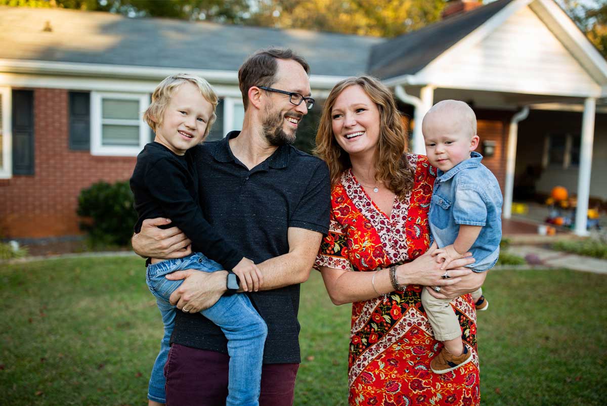 Family in front of a house