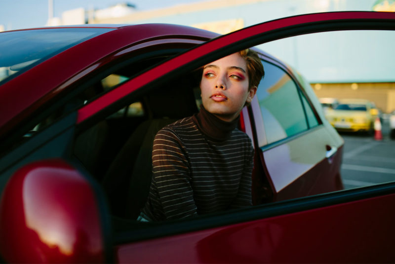 woman getting out of car